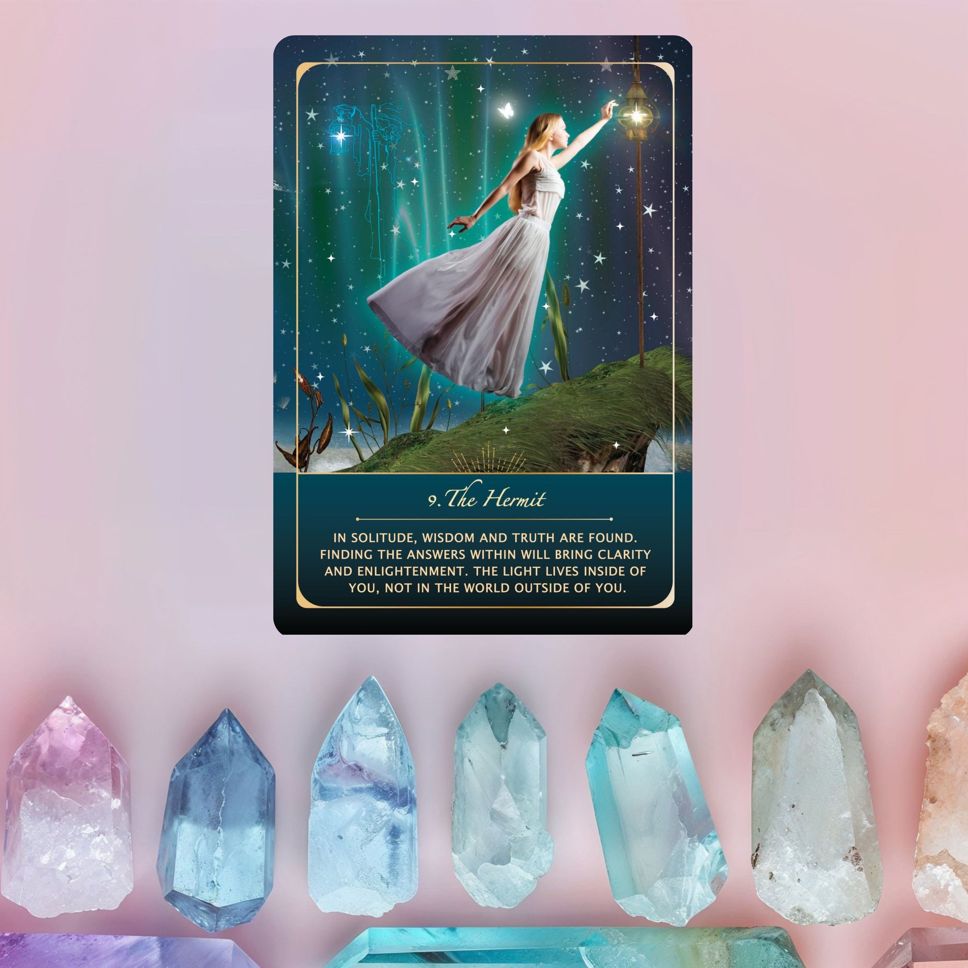 Tarot card featuring a woman in a dress with a lantern, surrounded by crystals on a pink background.
