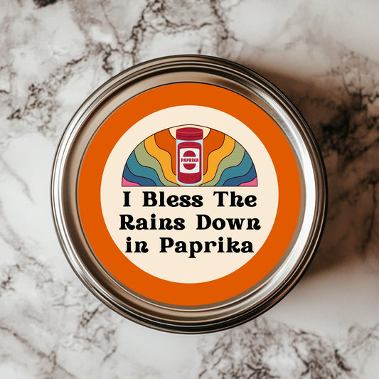 I Bless The Rains Down In Paprika Sticker – a humorous design featuring a paprika jar and vibrant rainbow backdrop, perfect for foodies and 80s music fans, ideal for adding fun to your kitchen decor with these Funny Kitchen Stickers.