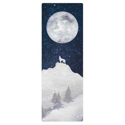 Howling moon yoga mat featuring a wolf silhouette on a snowy hill beneath a full moon in a starry night sky.