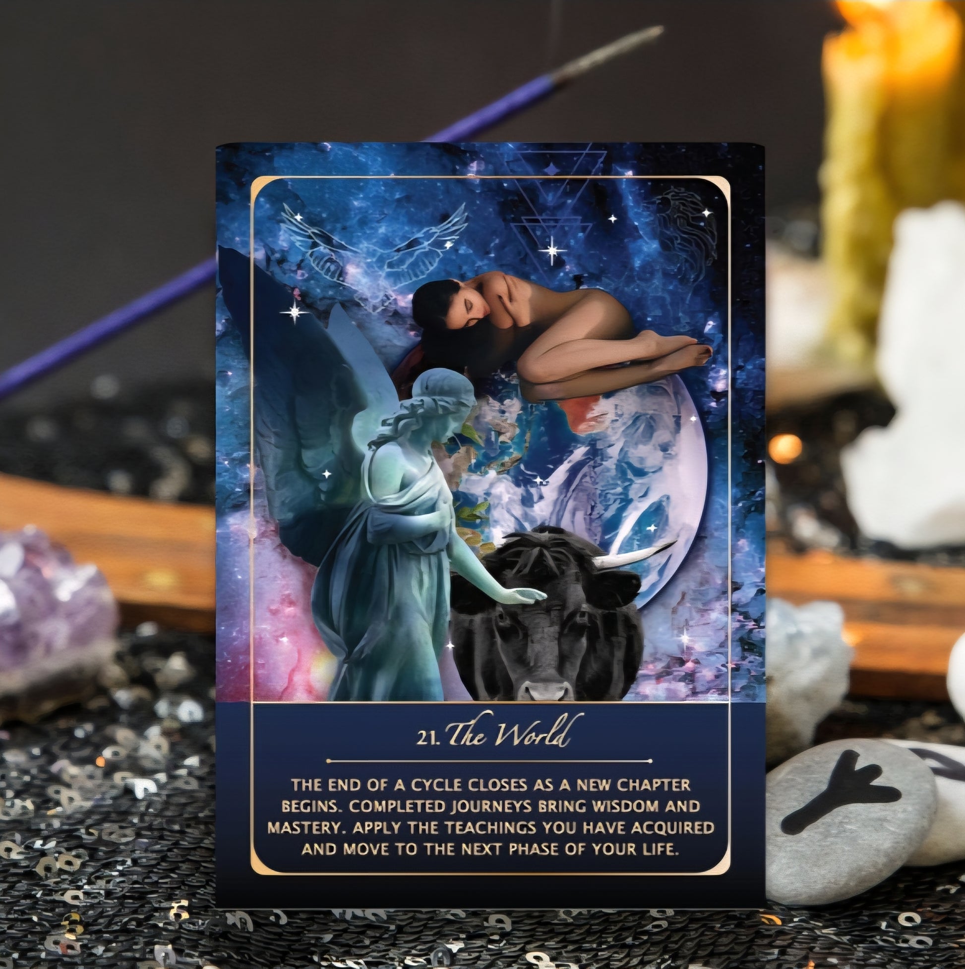 Tarot card titled 'The World' with celestial design and angelic figure on a mystical background.