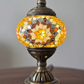 An enchanting view of the Golden Star Turkish Mosaic Lamp, showcasing its unique blend of clear and colorful glass.